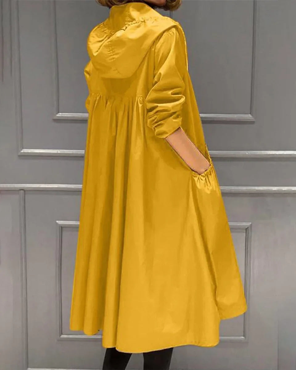 Women's long raincoat in yellow, hooded gathered back rain mac